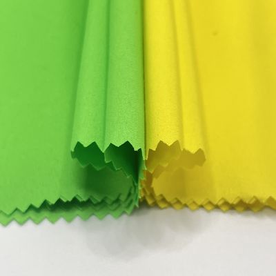 Pantalones de playa de terciopelo de piel de melocotón impermeable Tejido para ropa de playa de lujo de alto rendimiento