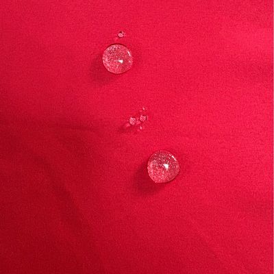 113gsm75D * 150D impermeable Brushed Twill Peach Skin Velvet Pantalones de playa rojos Tejido